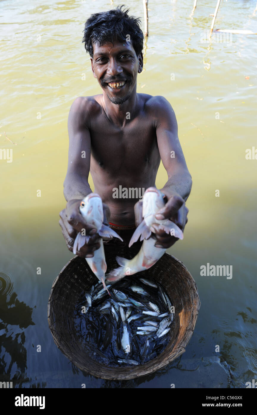 An Indian with his fish catch Stock Photo - Alamy
