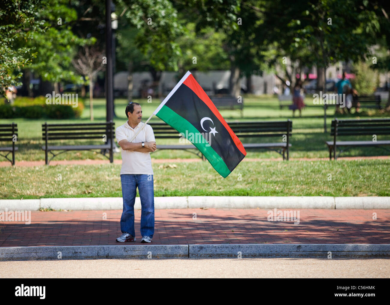 A man holding a Libyan Republic flag Stock Photo