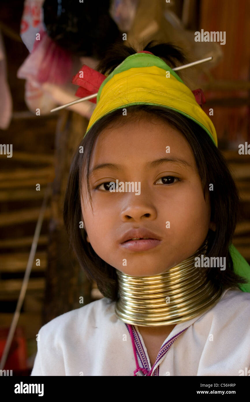 A Karen Paduang refugee woman wearing gold rings around her neck is