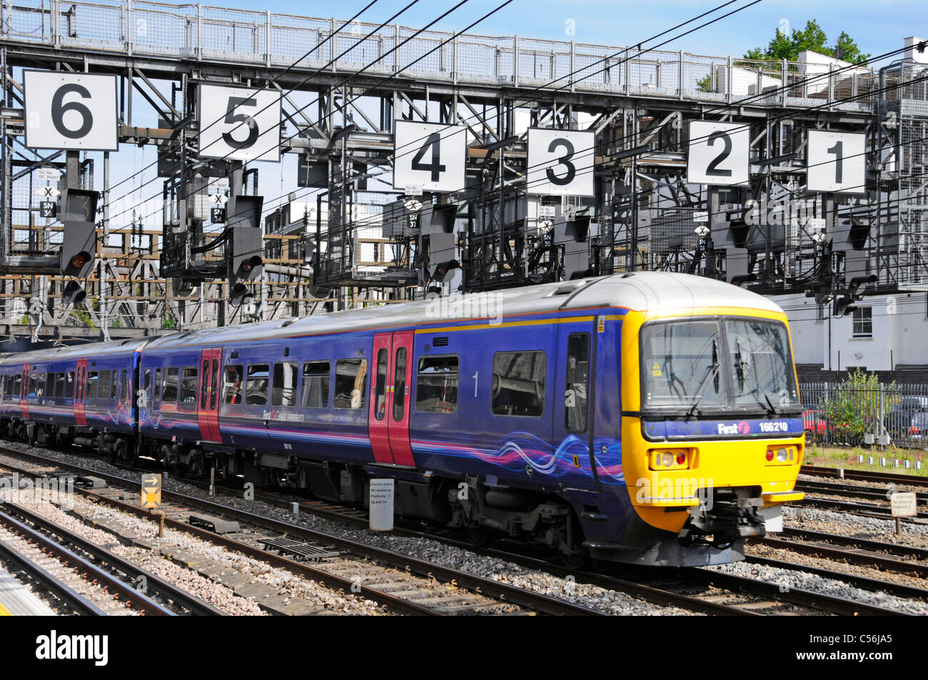 First Great Western train below signal gantry with very large numbers on  approach to Paddington station Stock Photo - Alamy
