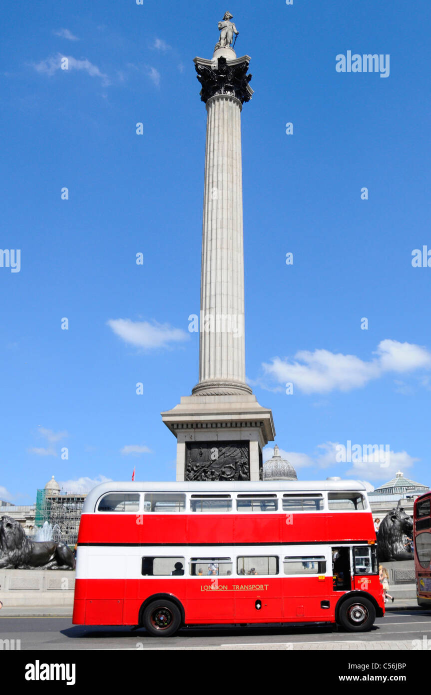 Routemaster double decker London bus passing Nelsons Column Trafalgar Square London England UK Stock Photo