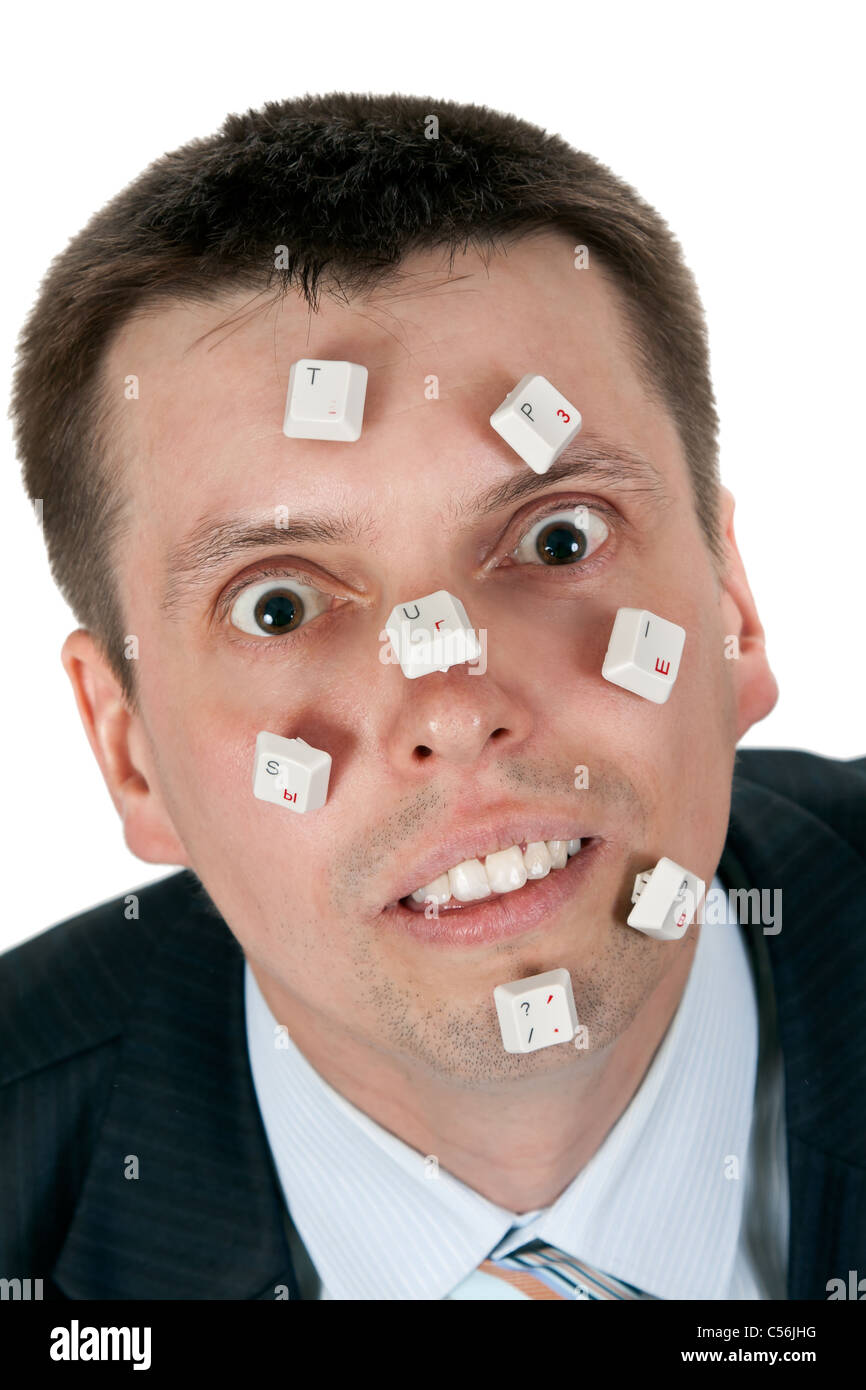word STUPID vylodennoe buttons on the face of businessman on white background Stock Photo