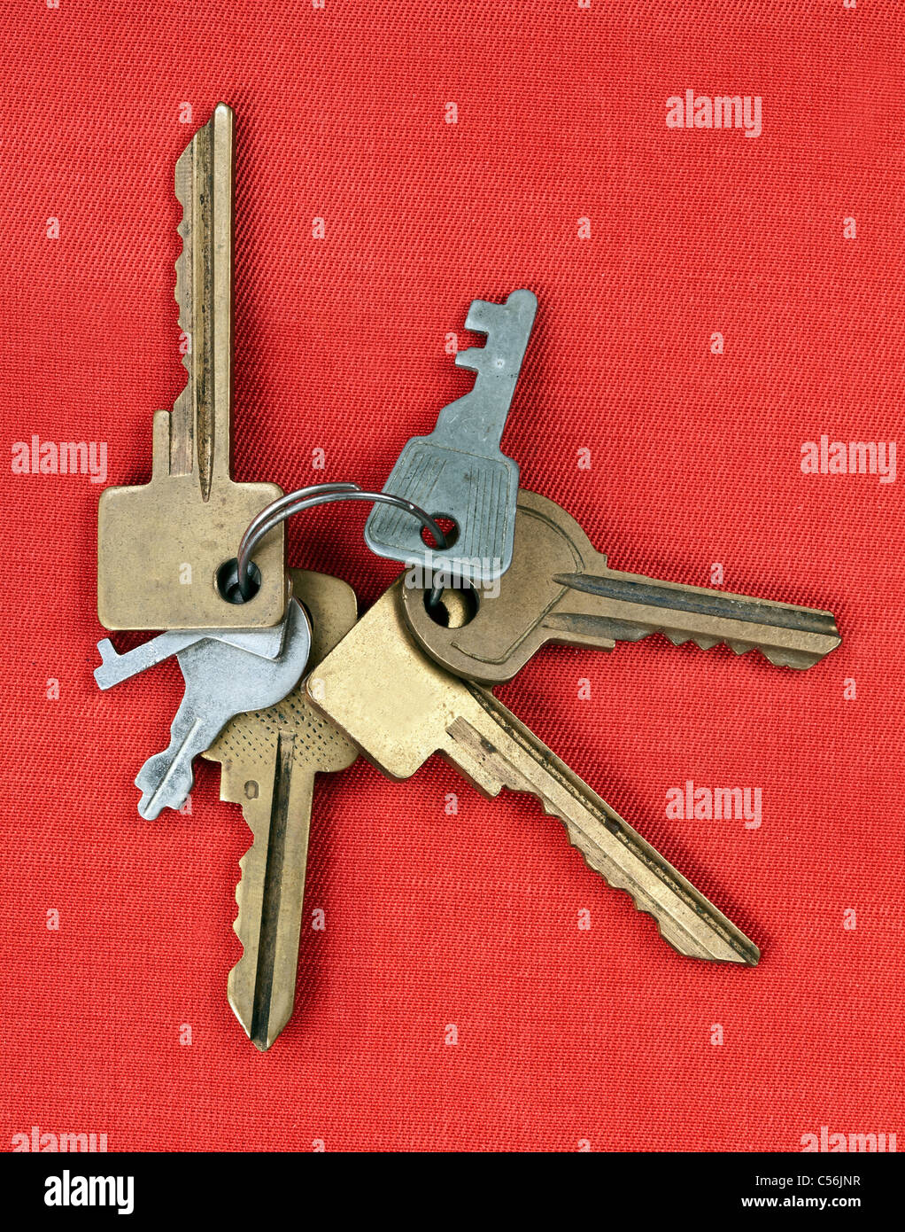 old keys from the door isolated on red background Stock Photo Alamy