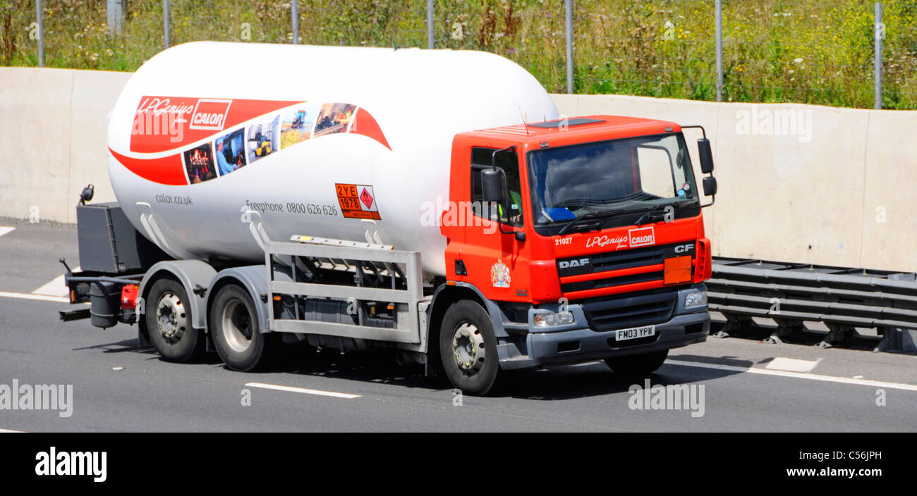 Short Calor Gas tanker delivery lorry truck driving on UK motorway road with Hazchem Hazardous Chemicals and Dangerous Goods warning plate signs Stock Photo