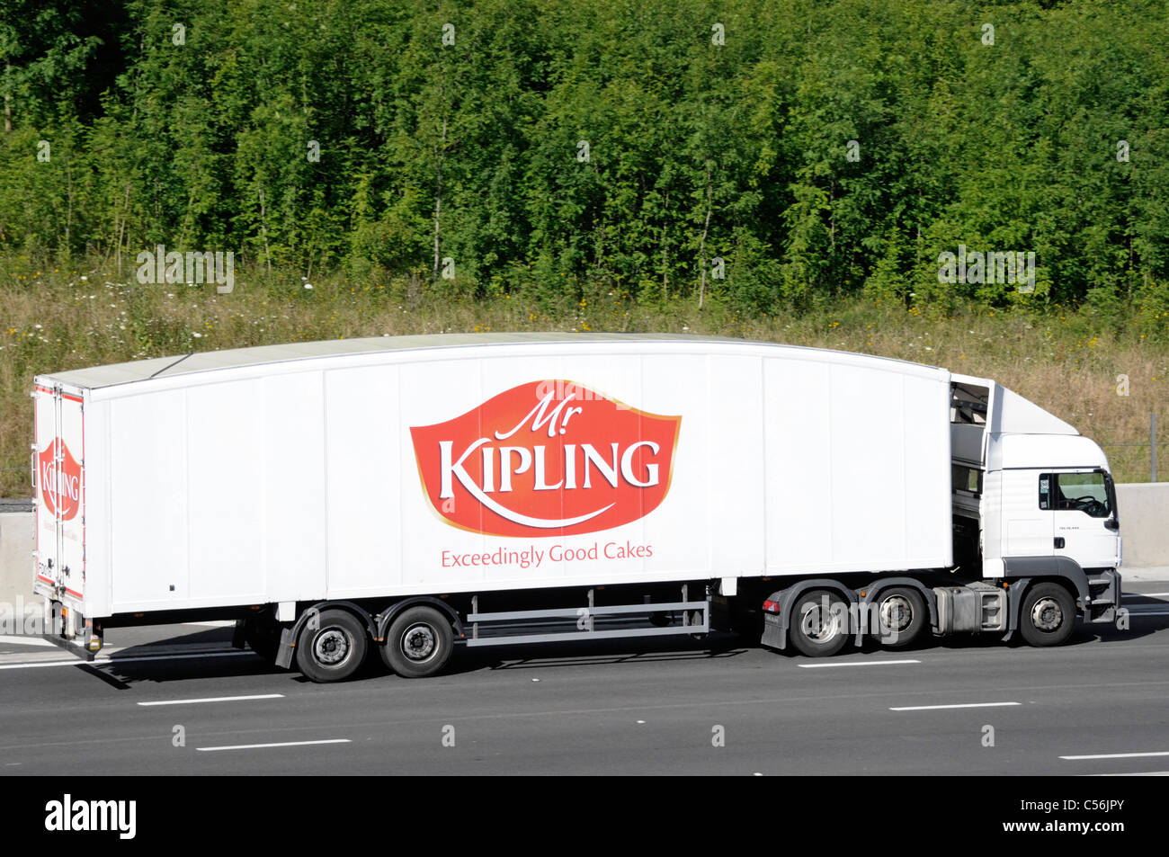 Premier Foods Mr Kipling Cake manufacturing business logo food supply chain distribution hgv lorry truck & trailer transport driving along UK motorway Stock Photo