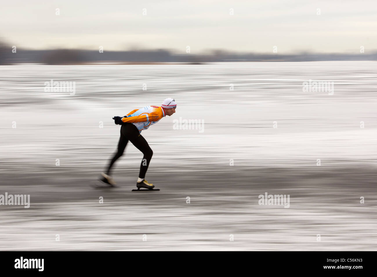The Netherlands, Ankeveen. Man ice skating. Motion blurred Stock Photo Alamy