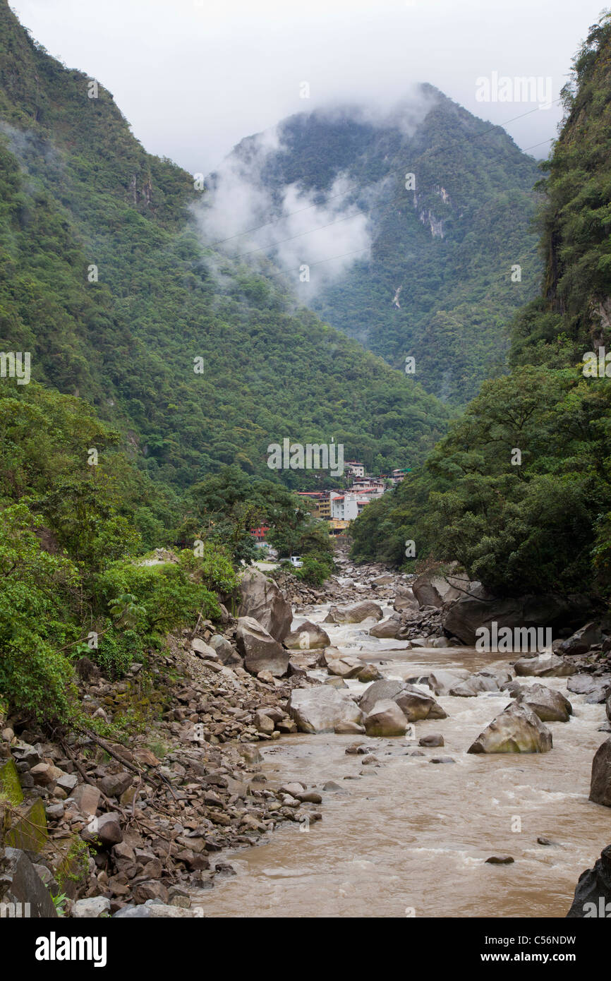 The River Vilcanota (also known as River Urubamba), with the tourist town of Aguas Calientes in the distance. Stock Photo