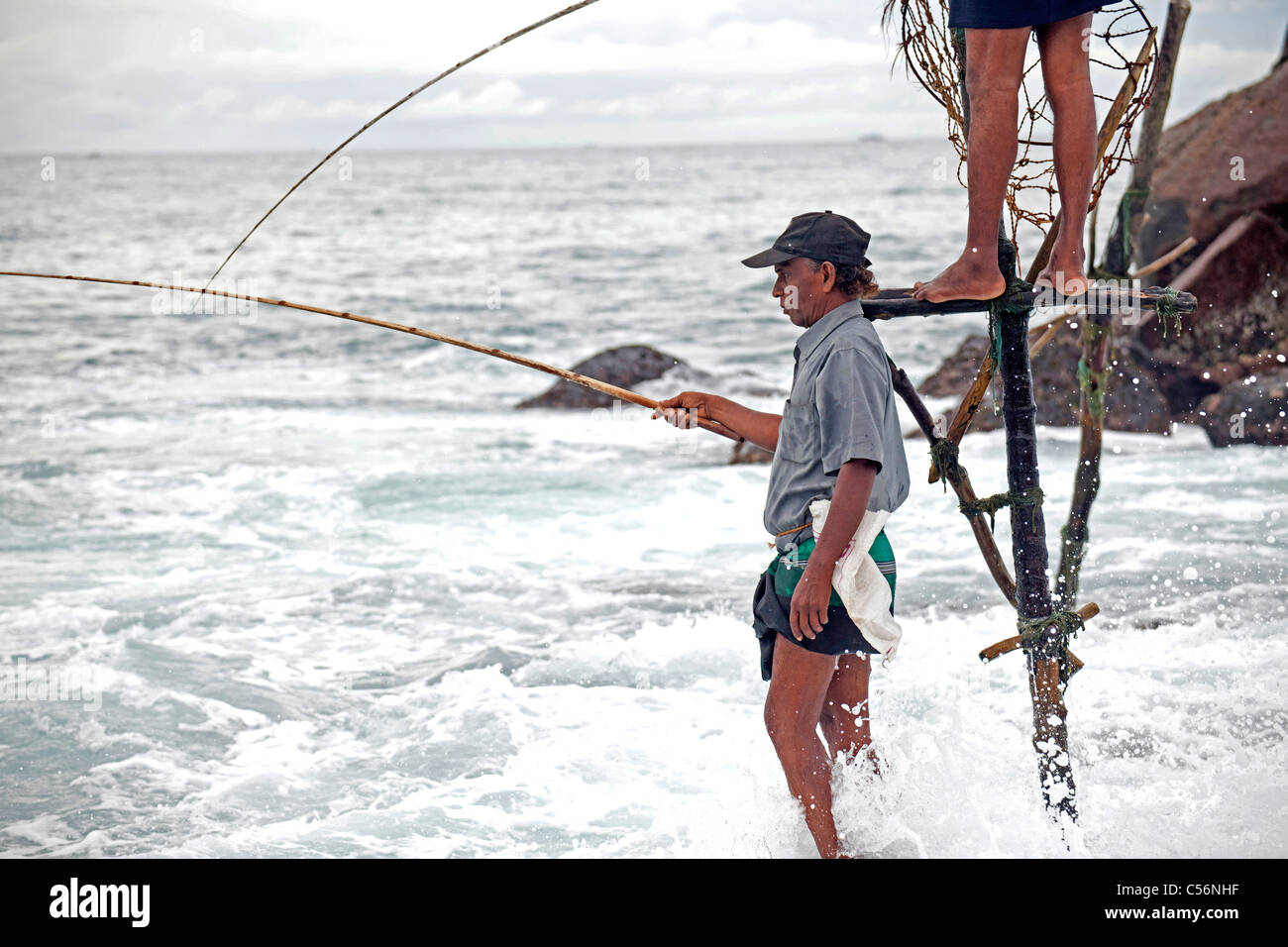 stilt fishing at the coast in Mirissa, Sri Lanka Stock Photo