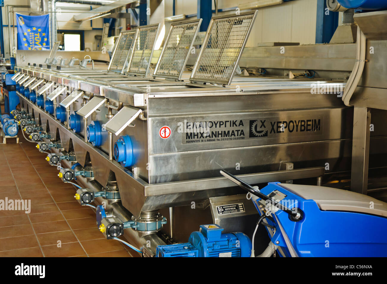 Olive crushers in a Olive Oil production factory Stock Photo