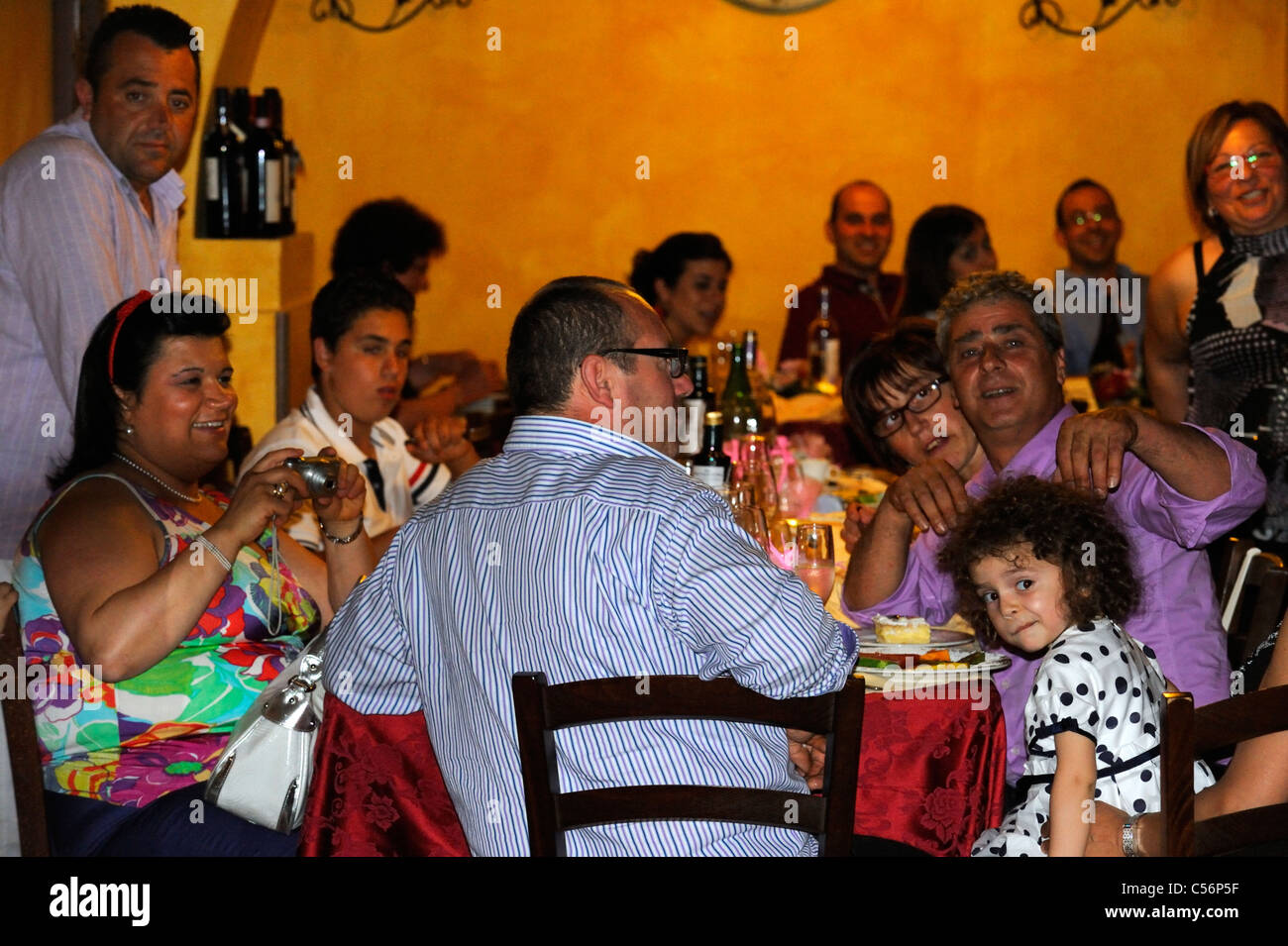 A Sicilian family enjoying Sunday lunch in Castelbuono Stock Photo