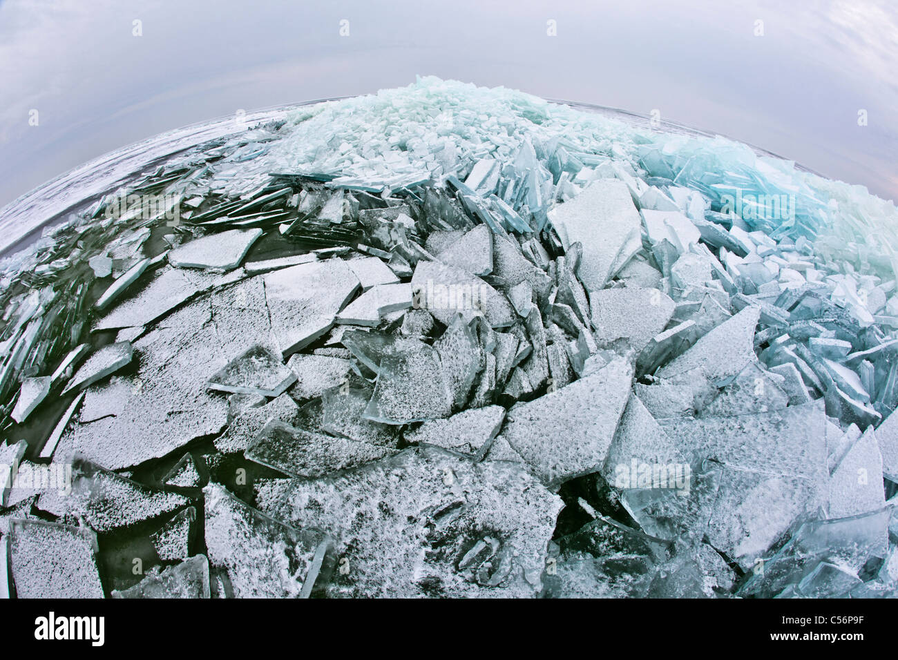 The Netherlands, Oosterleek, Piled up ice on frozen lake called Markermeer. Fisheye lens. Stock Photo