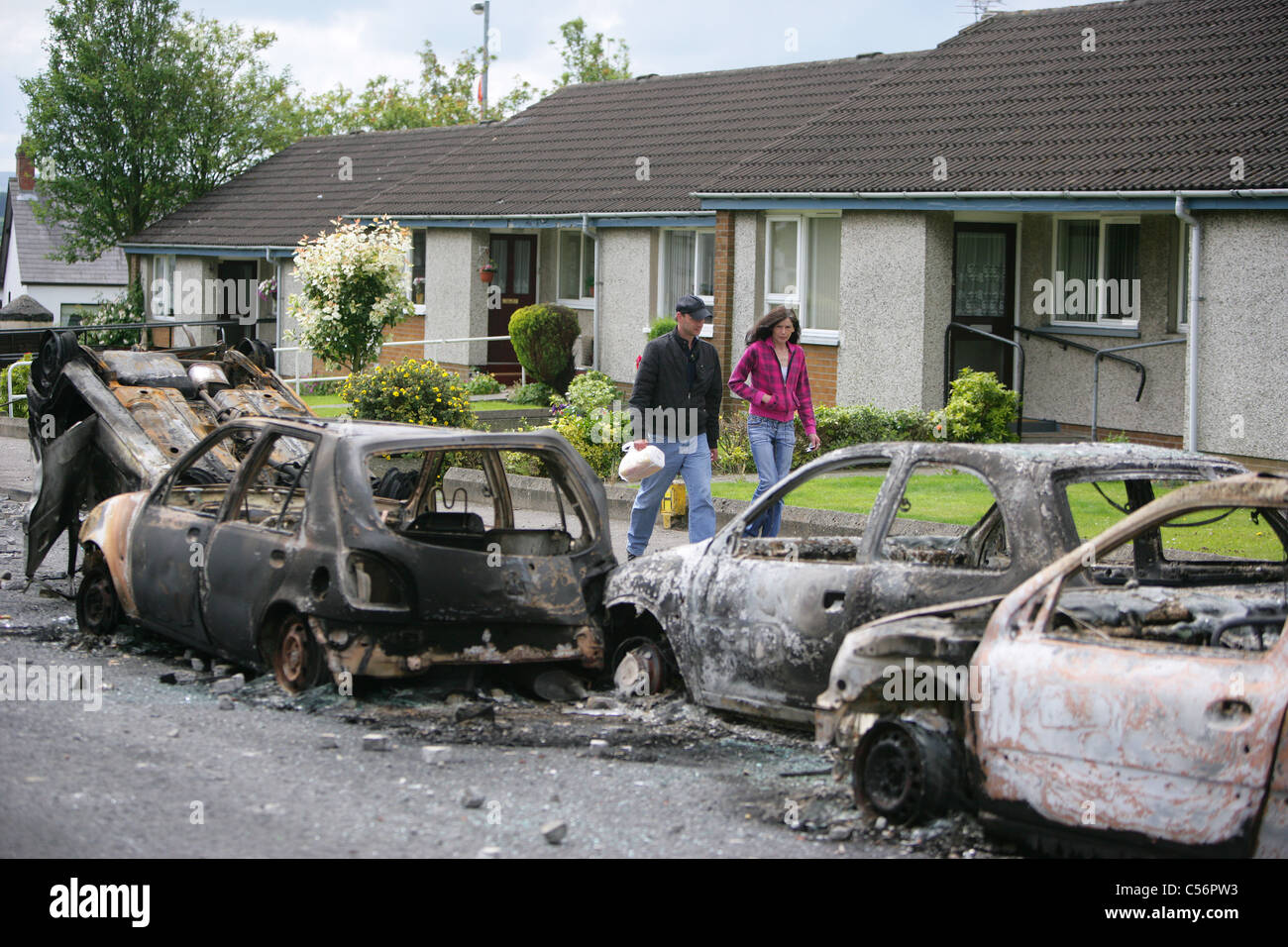 Burnt out cars litter the Grange Estate in Ballyclare, following a ...