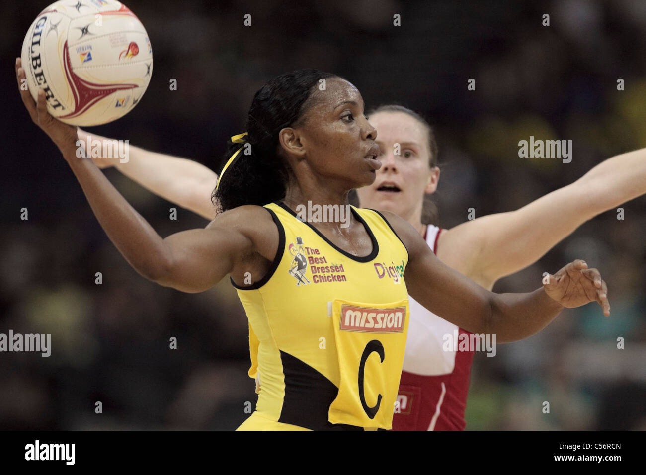 10.07.2011 Nadine Bryan of Jamaica in action during the 3rd place playoffs between Jamaica and England, Mission Foods World Netball Championships 2011 from the Singapore Indoor Stadium in Singapore. Stock Photo