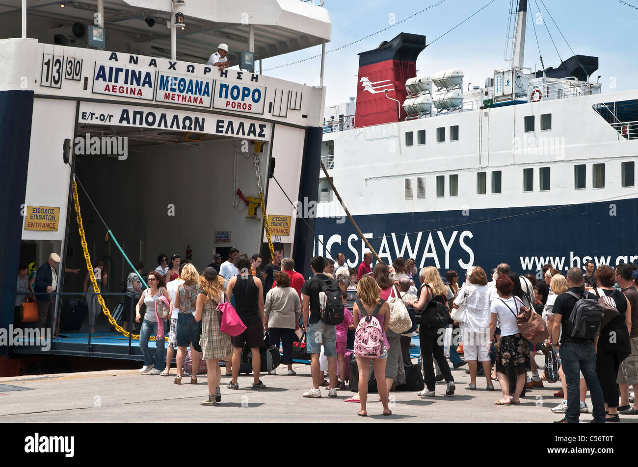 Passengers embarking and disembarking from a Greek ferry in the harbour at Pireaus, Athens, Greece. Stock Photo