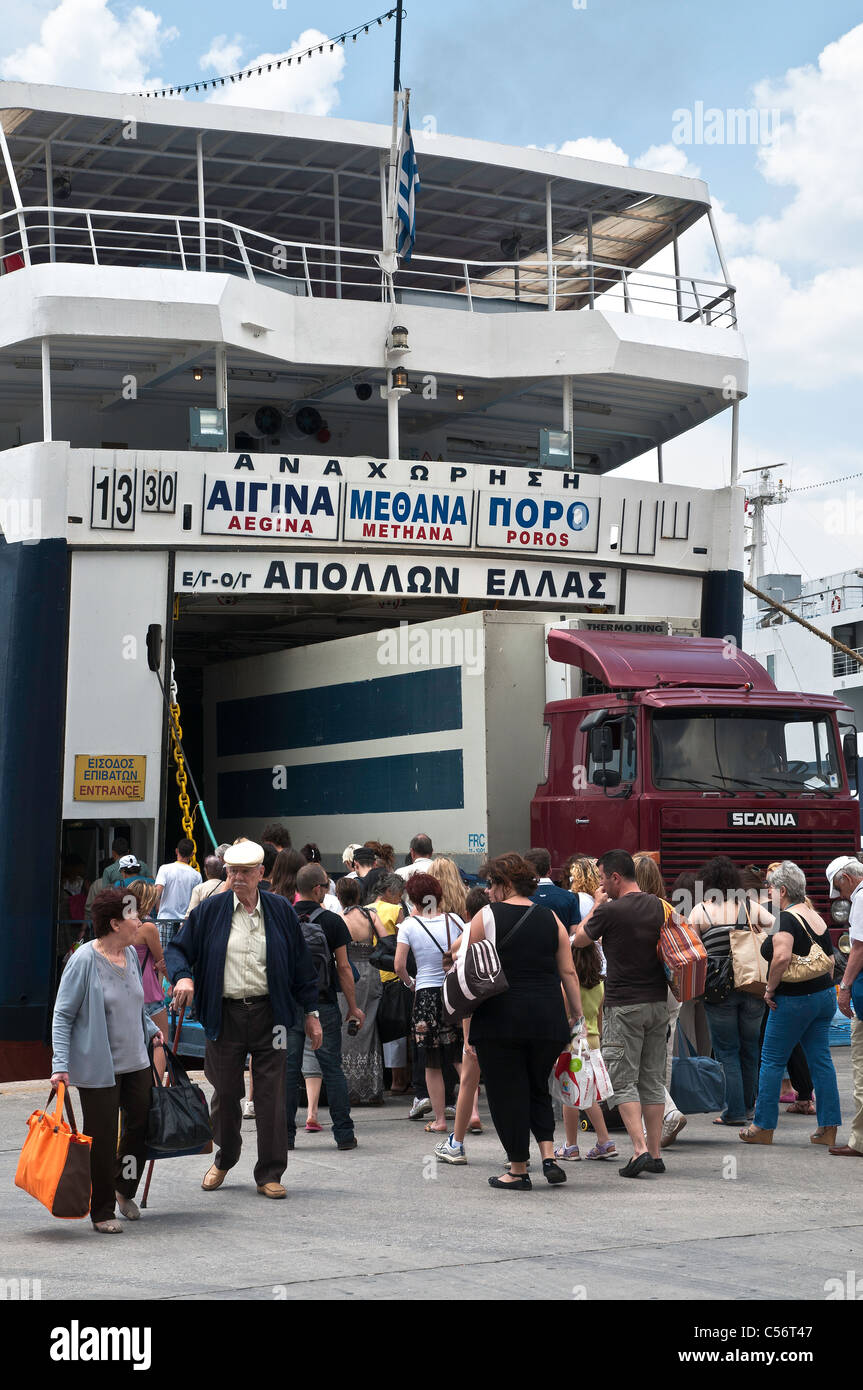 Passengers embarking and disembarking from a Greek ferry in the harbour at Pireaus, Athens, Greece. Stock Photo