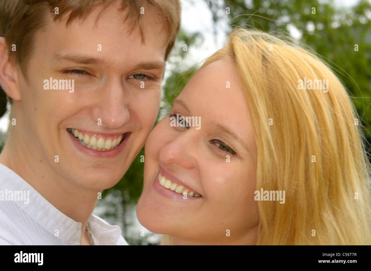 Smiling faces of bond white Eastern European couple Stock Photo
