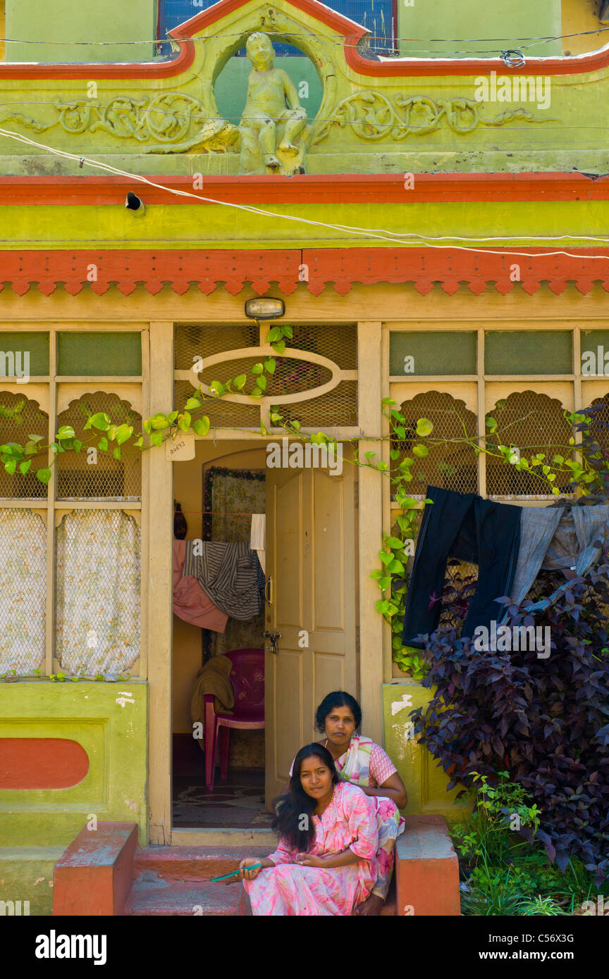 Mother and daughter in front of their home, Mysore, Karnataka, India. Stock Photo