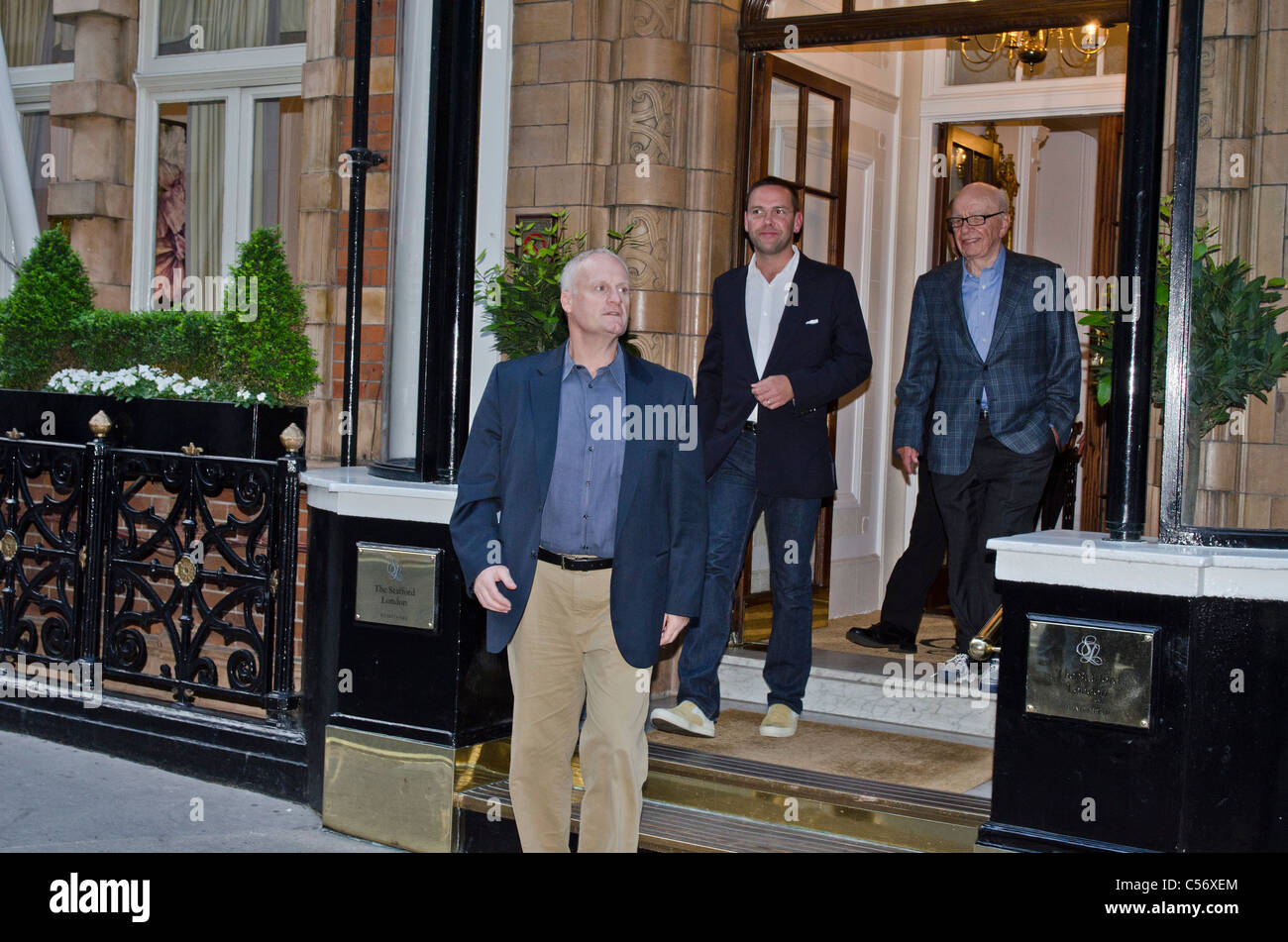 James and Rupert Murdoch outside Stafford Hotel  St james's Place London Uk Media tycoon. Media phone hacking scandal discussion Stock Photo