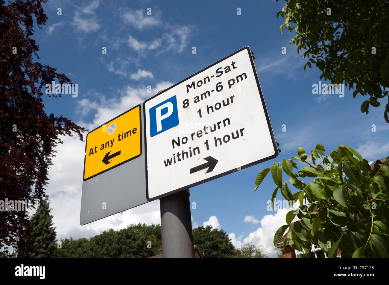 Roadside no parking sign against a blue sky Stock Photo