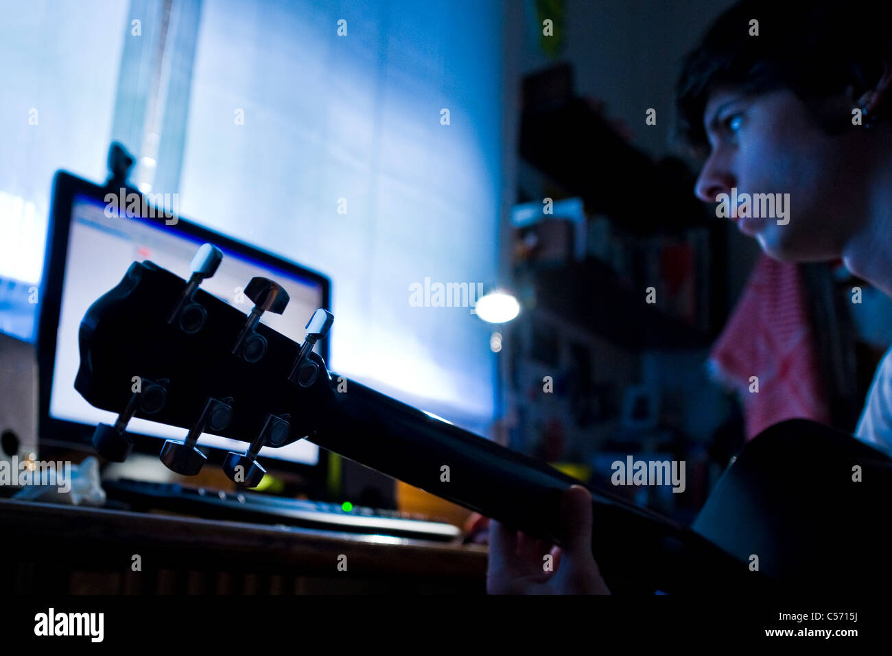 Boy with guitar, Computer Stock Photo - Alamy