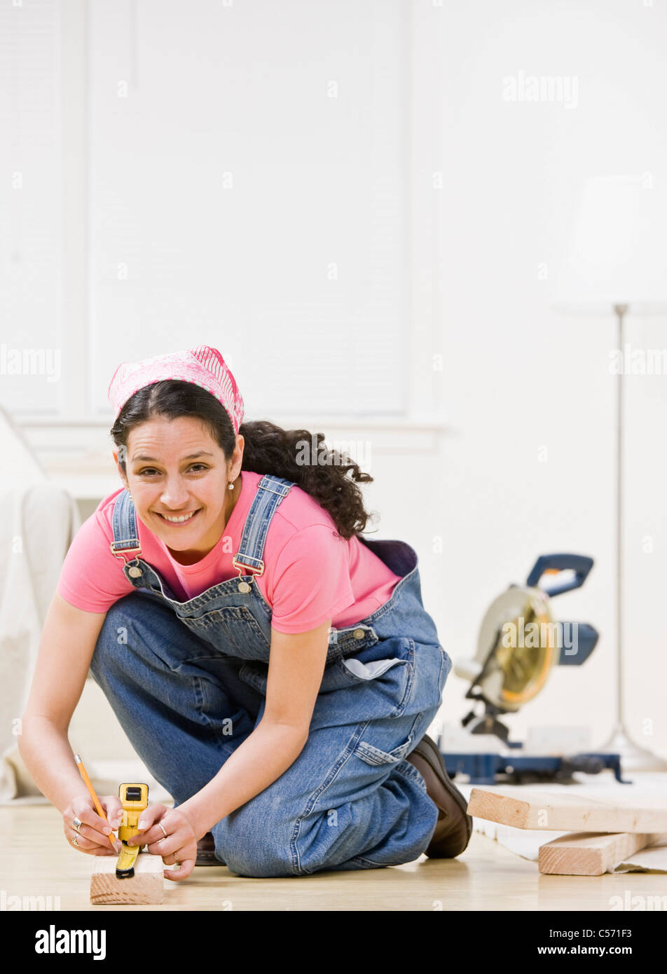 Woman using power tools at home Stock Photo Alamy