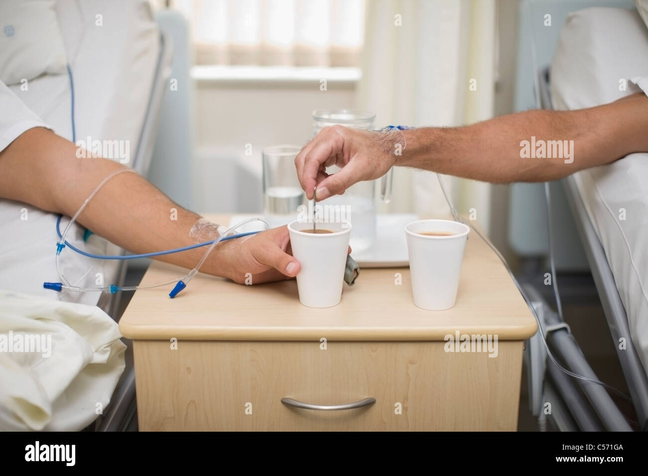 Patients having coffee in hospital beds Stock Photo Alamy