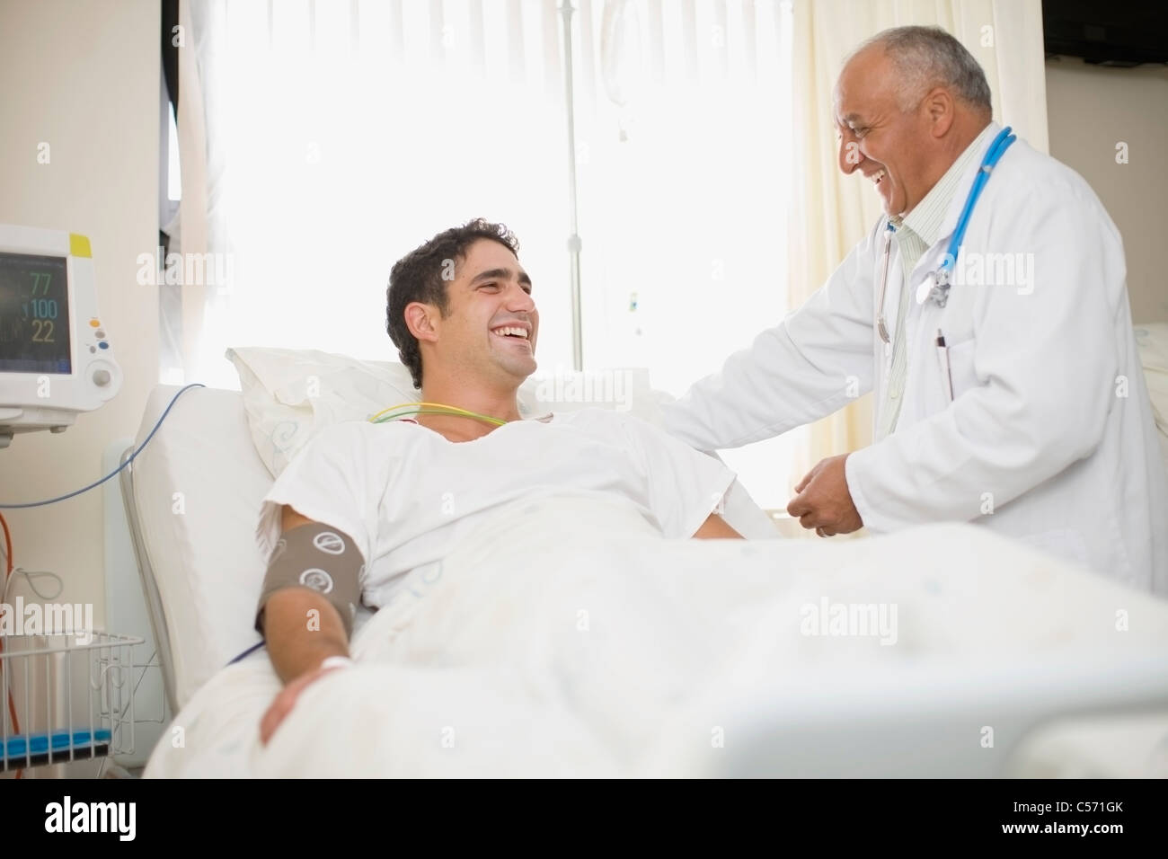 Doctor tending to hospital patient Stock Photo