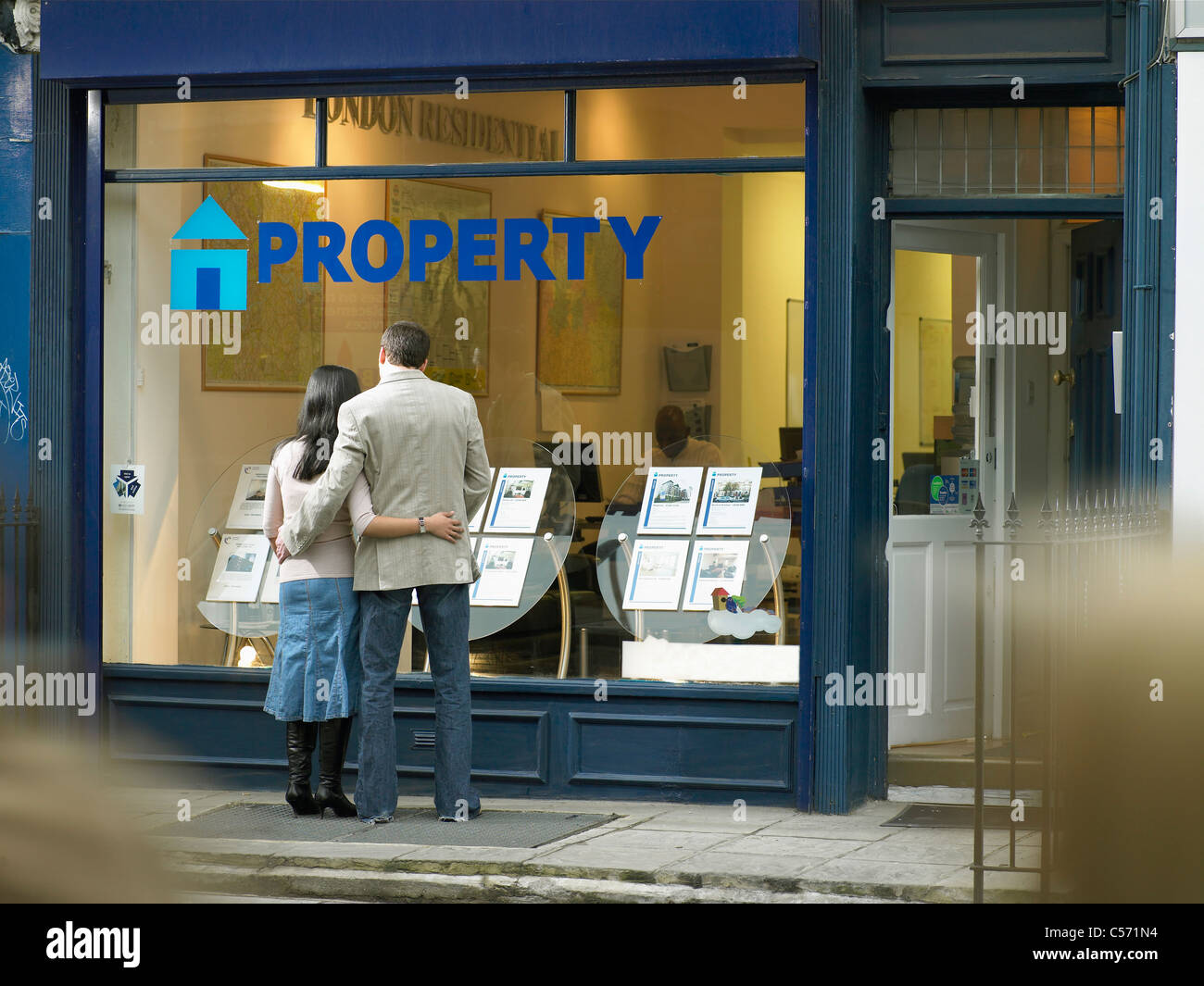 Couple examining real estate for sale Stock Photo