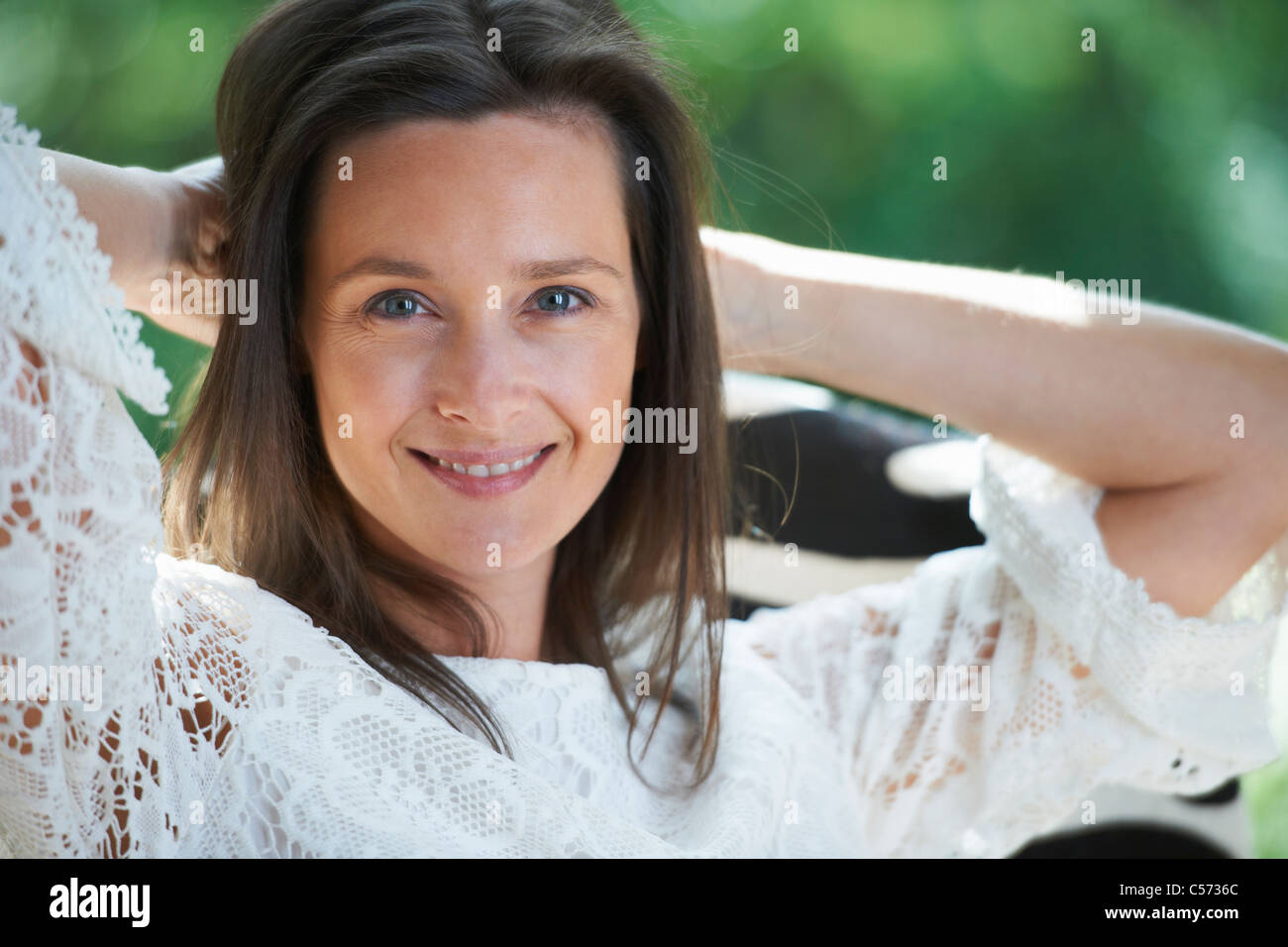 Woman stretching outdoors Stock Photo