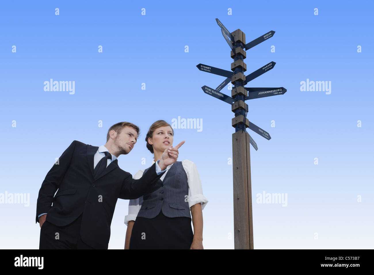 Business people at crossroads Stock Photo