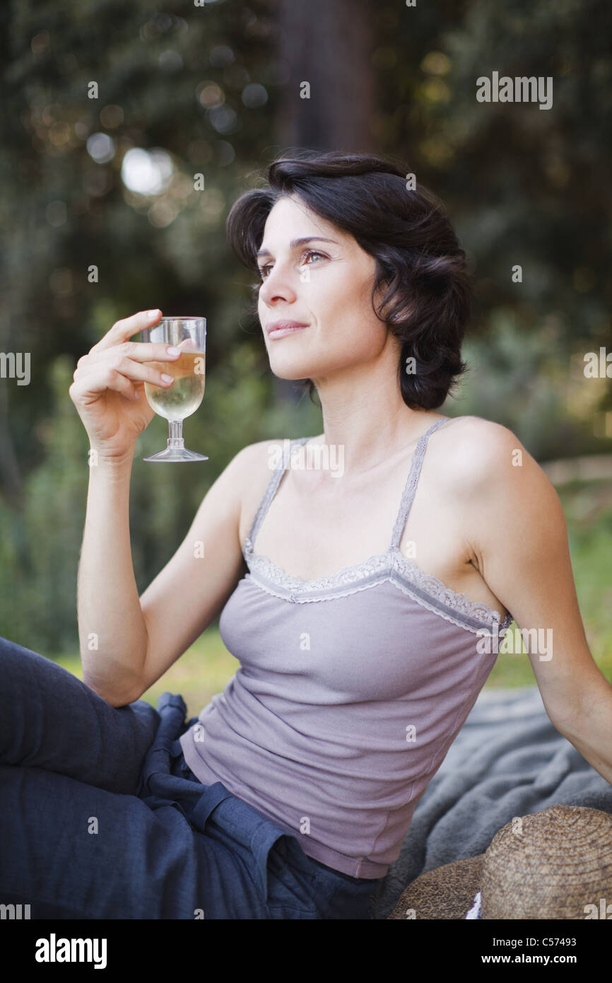 Woman drinking wine outdoors Stock Photo - Alamy