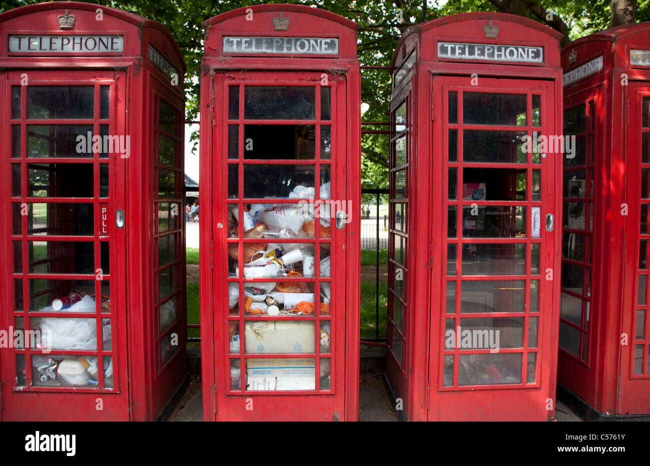 Telephone boxes full of rubbish in Park Lane, London Stock Photo Alamy