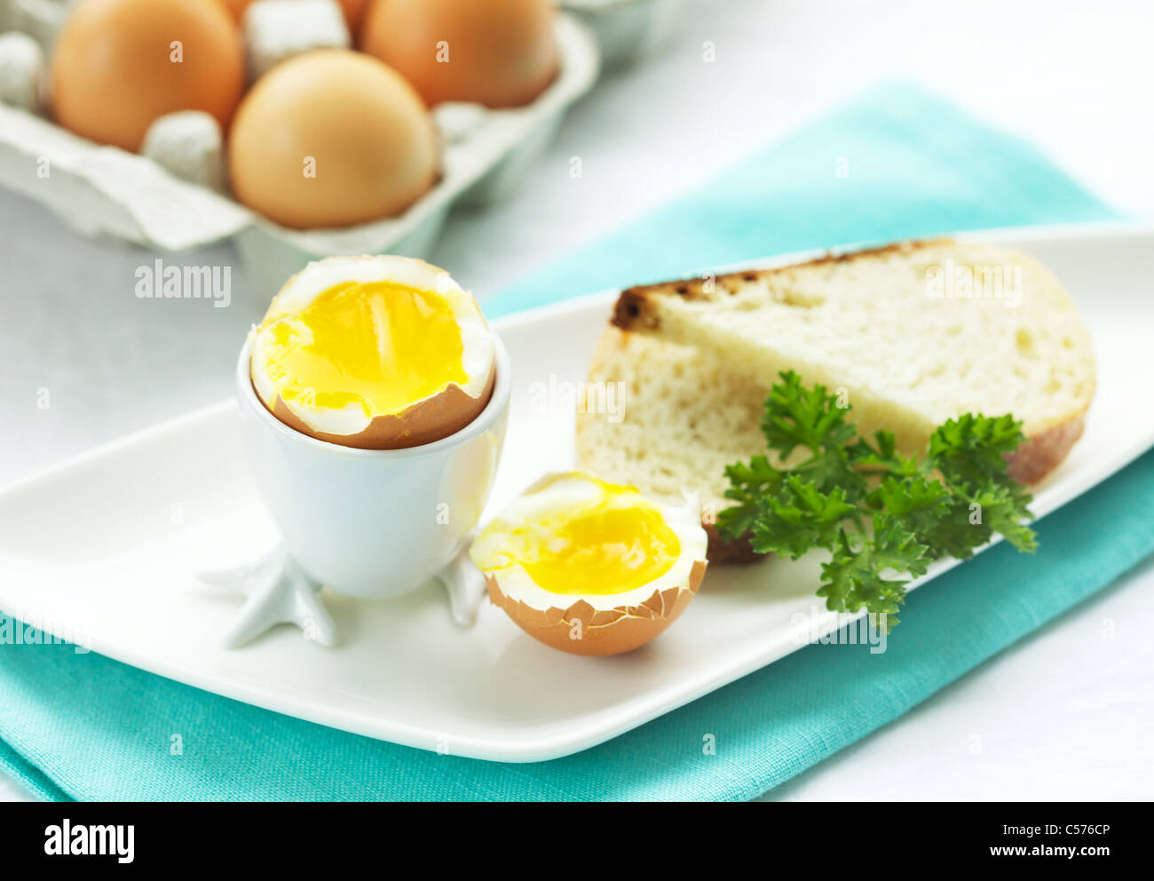 A soft boiled egg and bread for breakfast Stock Photo - Alamy