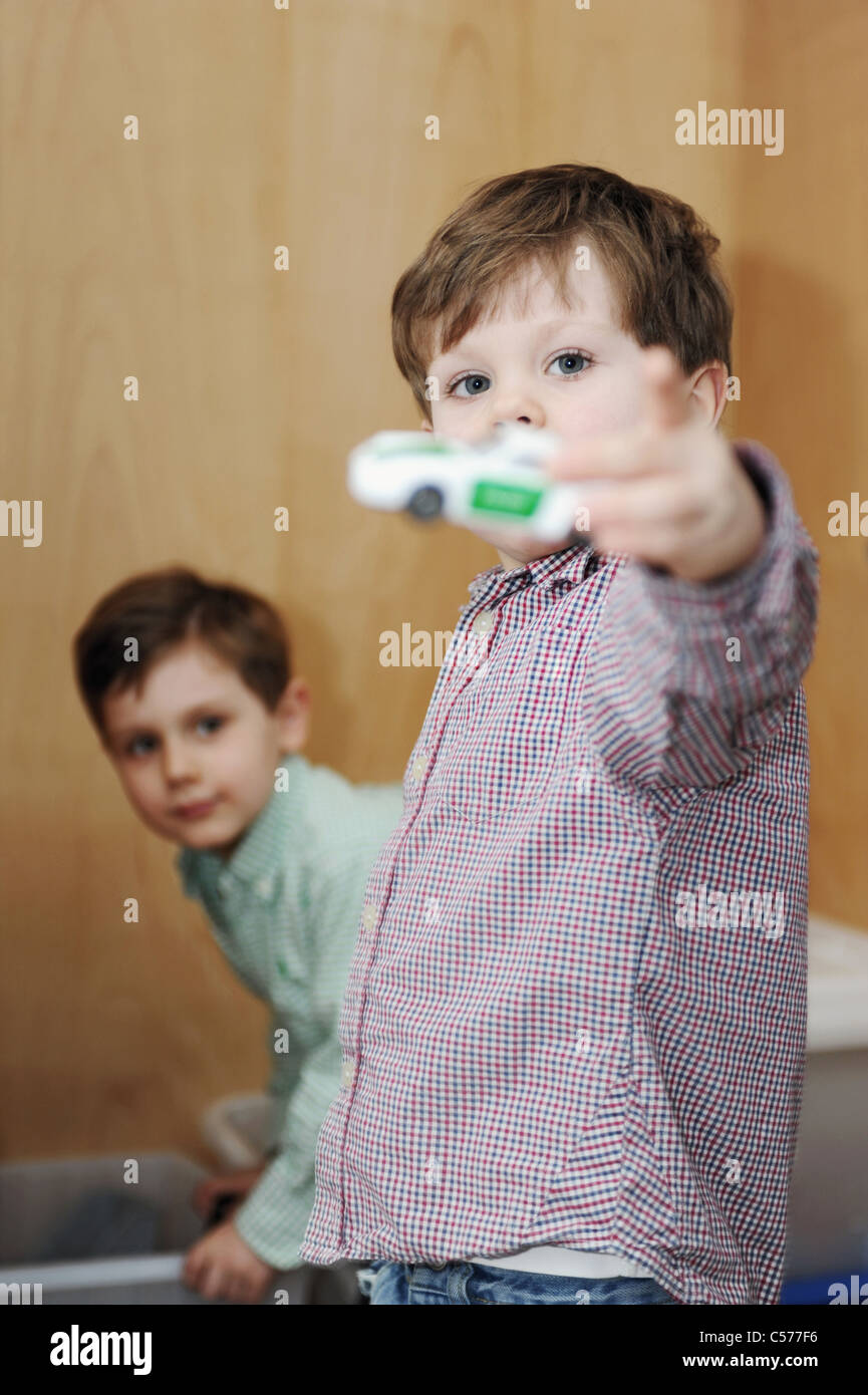 Boys playing with toy cars Stock Photo - Alamy