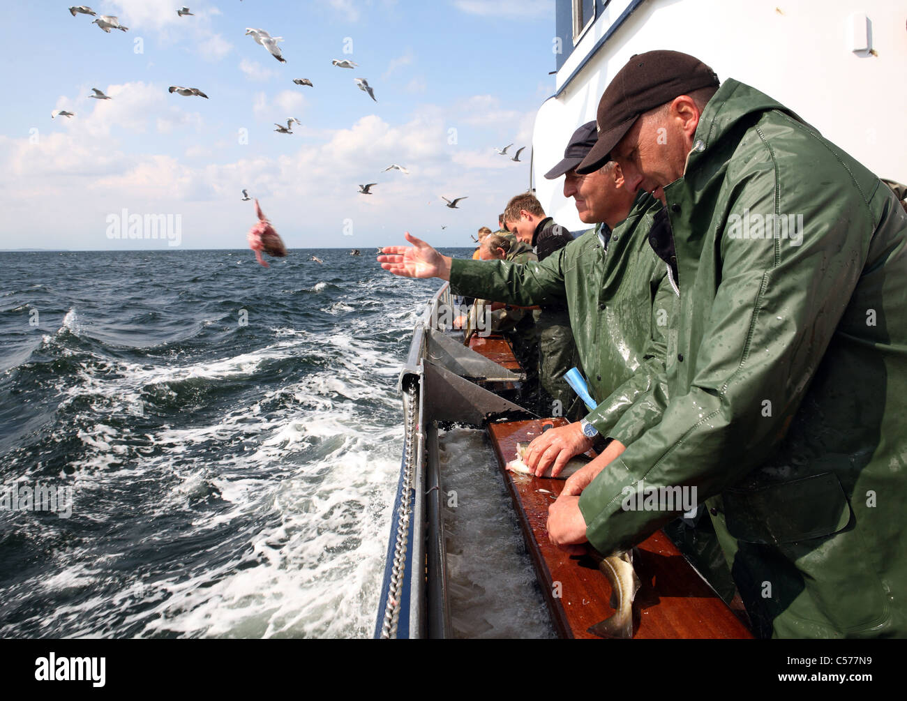 Men during deep sea fishing Stock Photo