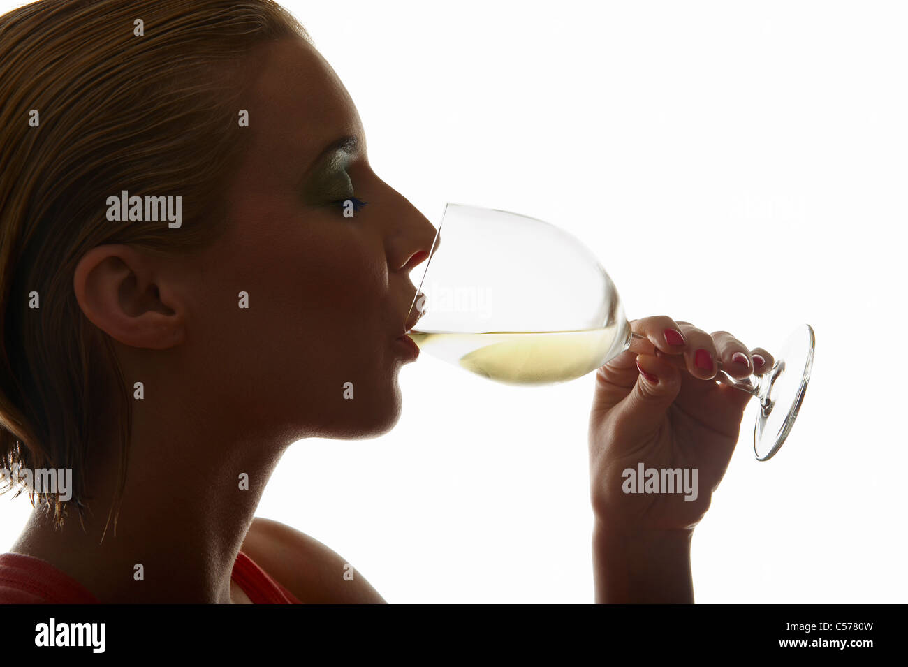 Woman drinking glass of wine Stock Photo