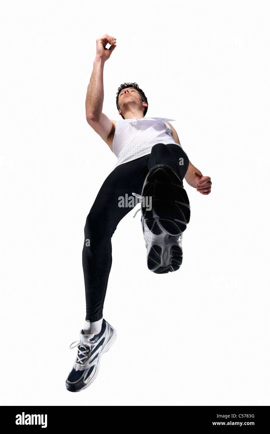 Low angle view of man jogging Stock Photo