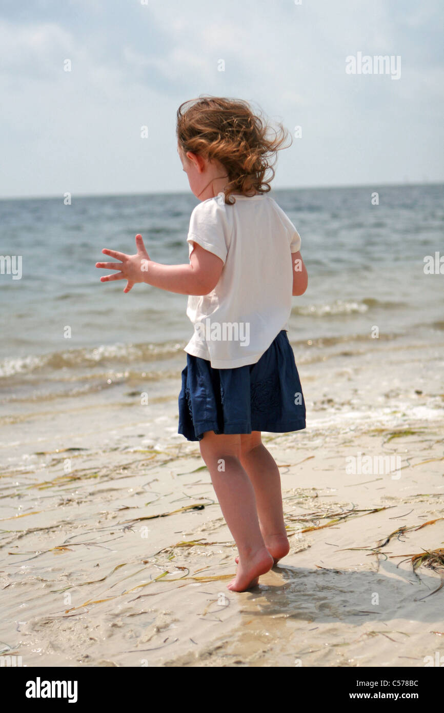 baby stands on tiptoes