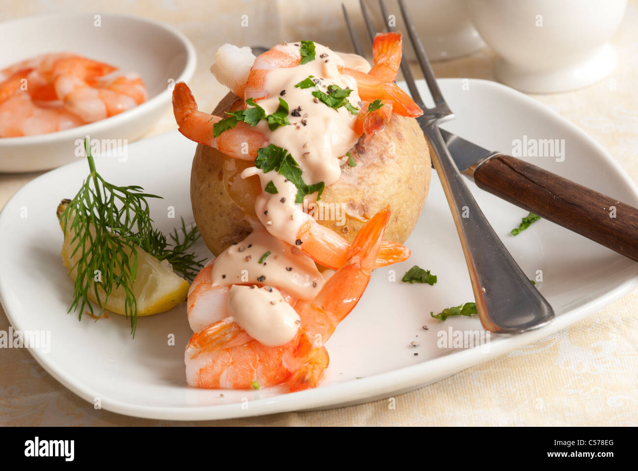 Jacket potato filled with prawns Stock Photo Alamy