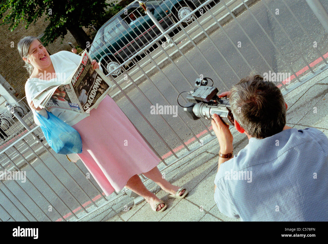 Martin Parr filming a woman during the making of 'London' music video for the Pet Shop Boys. Stock Photo