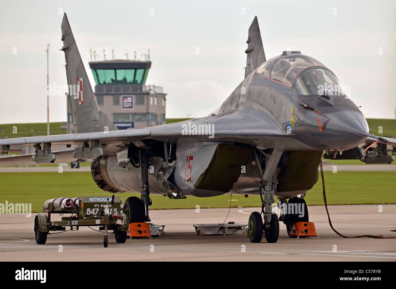 mig 29 jet aircraft in front of control tower Stock Photo