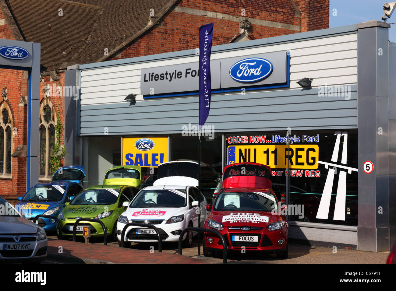 New registration cars for sale on Ford showroom forecourt, Mount