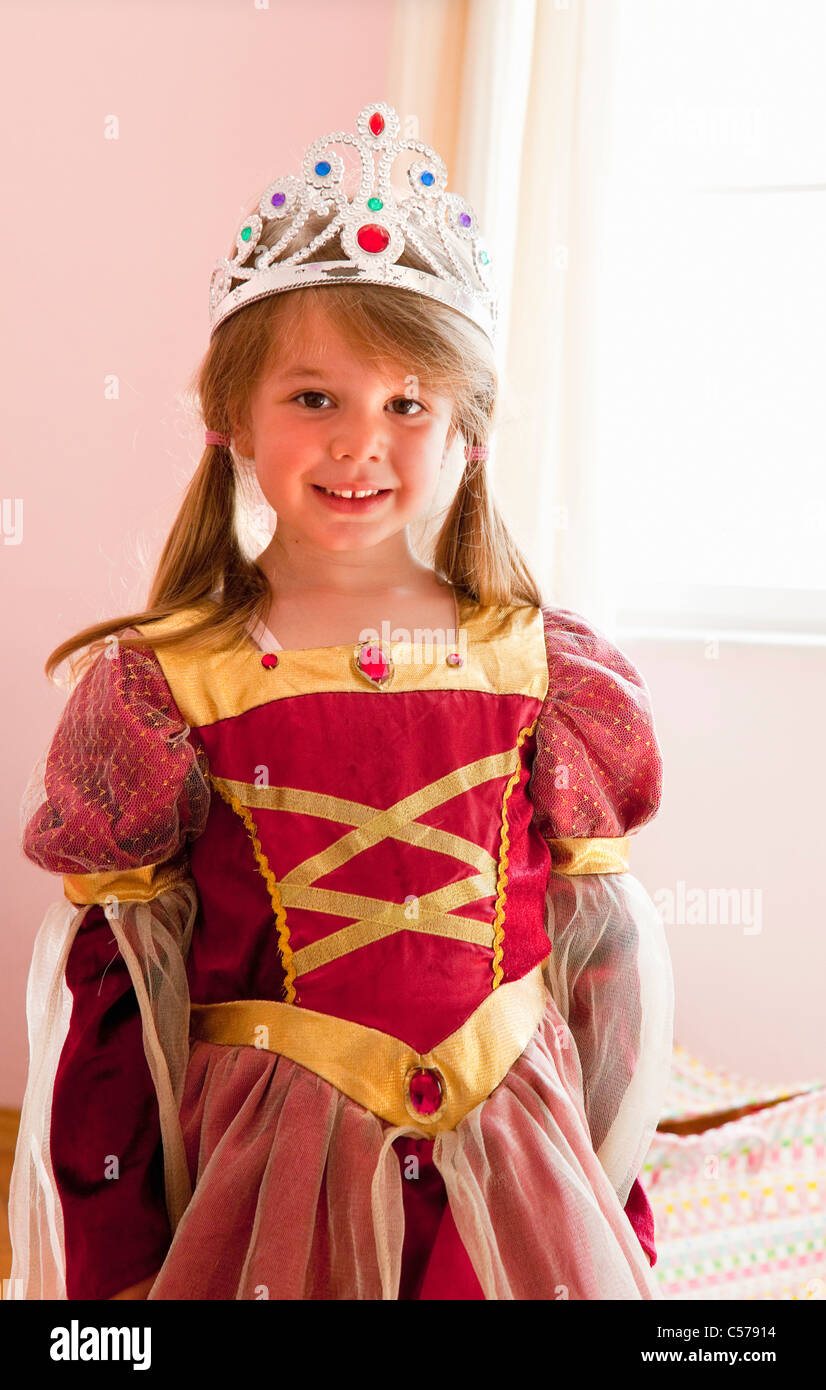 Smiling girl playing dress up Stock Photo Alamy