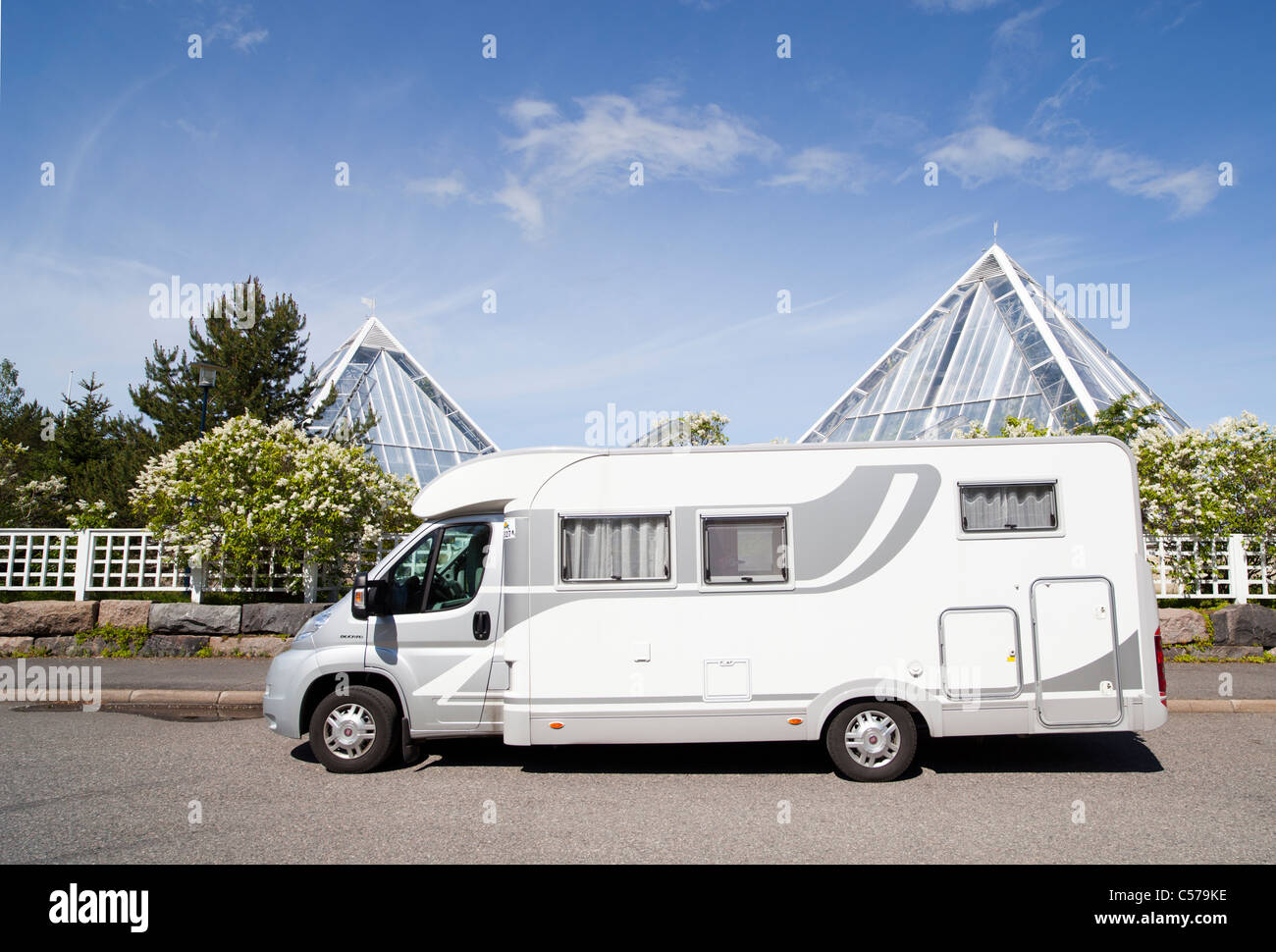Isolated camper van parked at Oulu University Botanical Garden , Finland Stock Photo