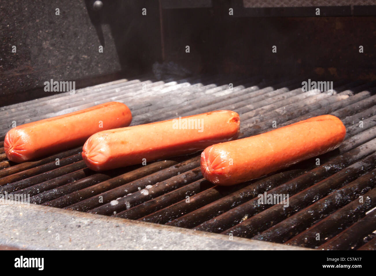 Hot dogs on a bbq Stock Photo