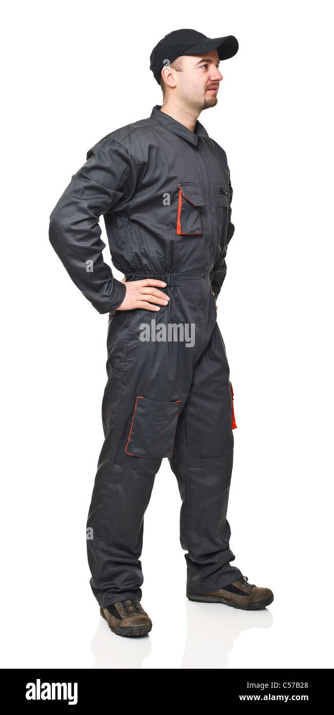 fine portrait of standing manual worker with garage suit Stock Photo