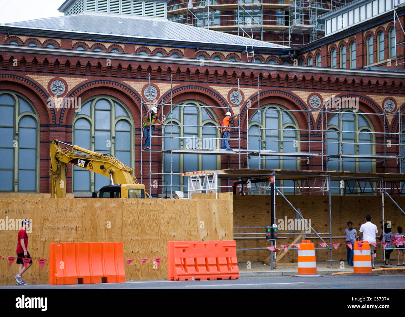 Old brick building getting covered in scaffolding in preparation of ...