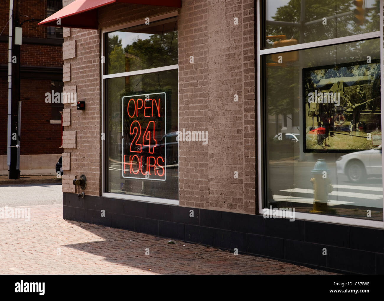 Red Open 24 Hours neon sign in window Stock Photo Alamy