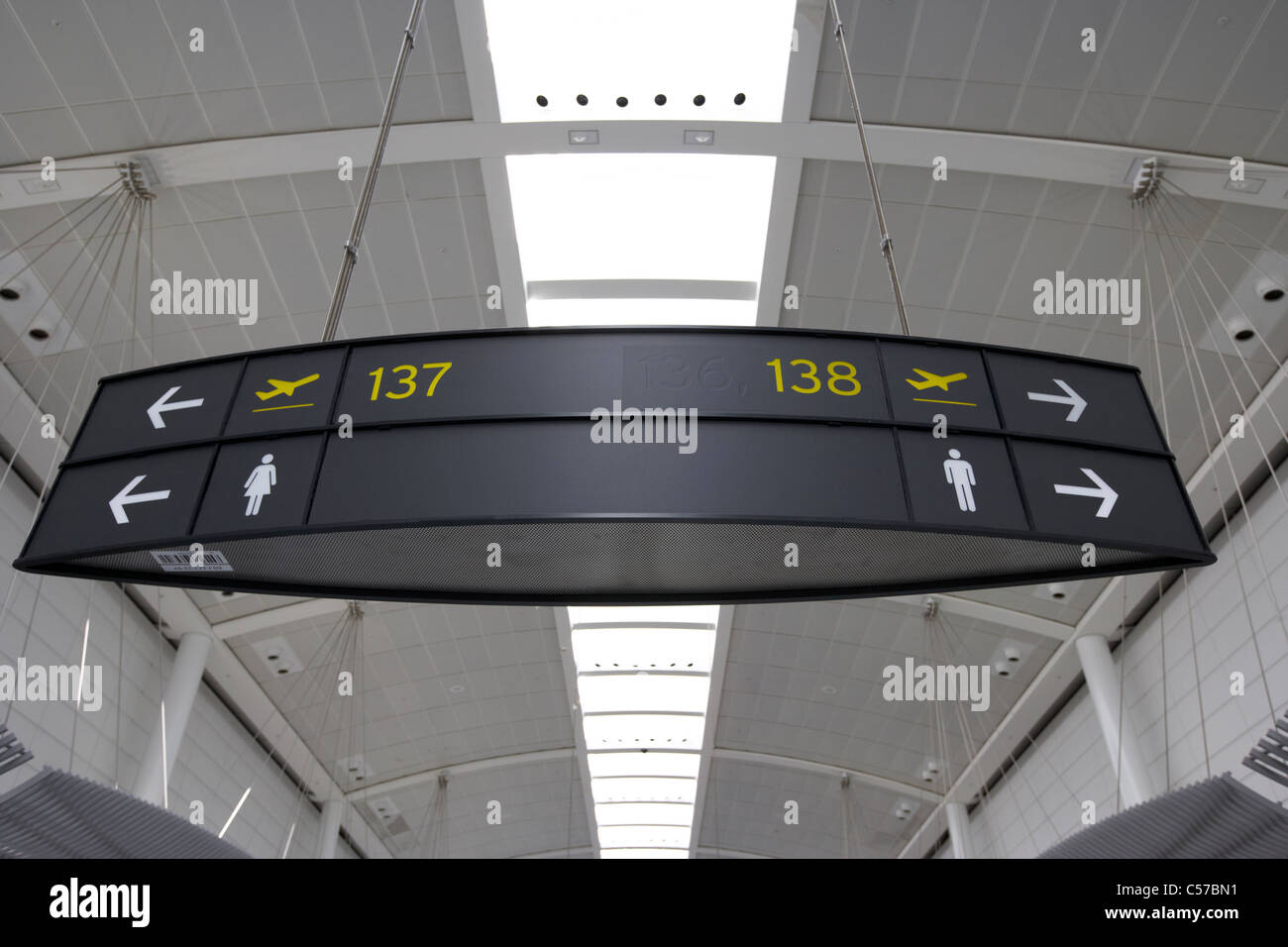 departure gate and toilet signs in lounge terminal 1 Toronto Pearson International Airport Ontario Canada Stock Photo