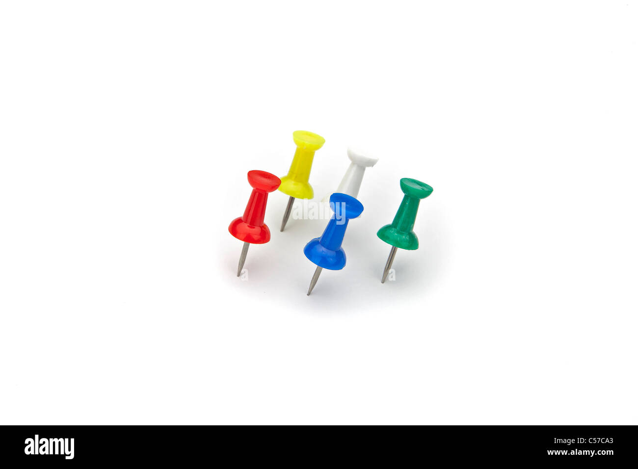 for five thumbtacks of various colors on white background Stock Photo